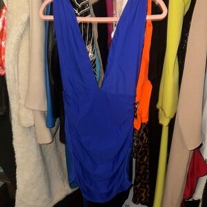 Super down super hot blue dress in size xs in ready to party! Deep V.